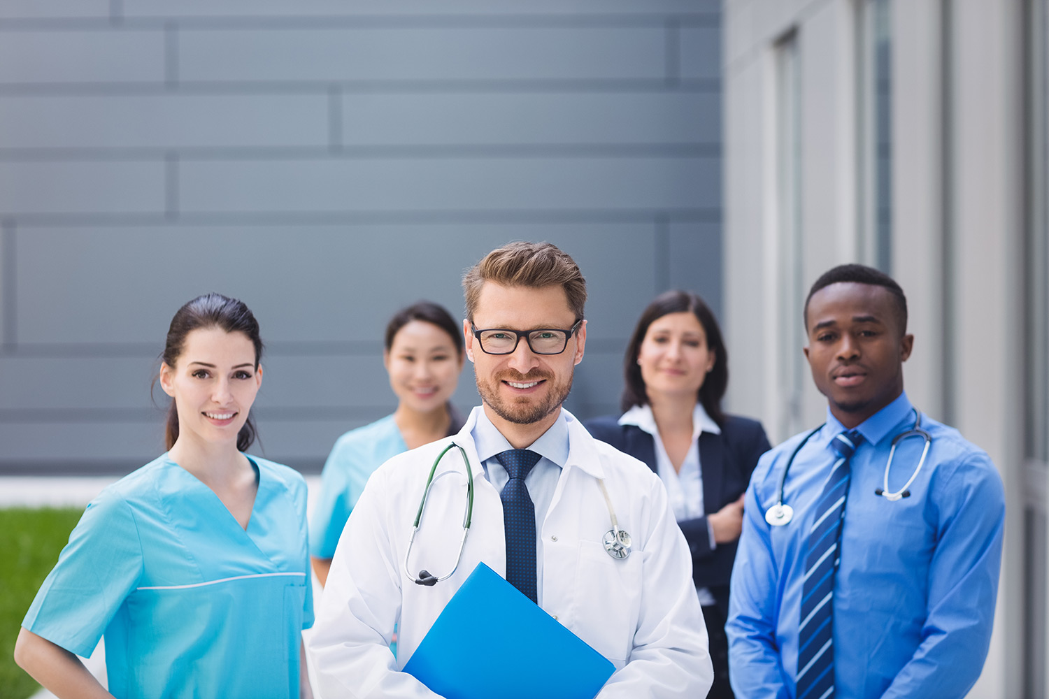 team-doctors-standing-together-hospital-premises